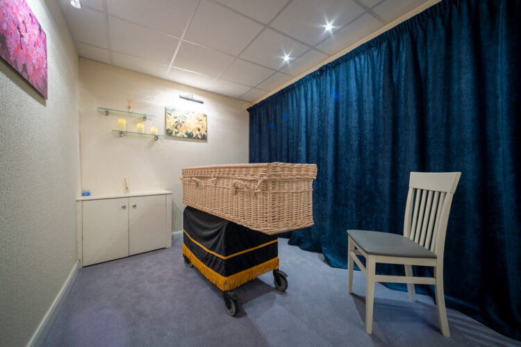 Chapel of Rest in Welham Jones's Tonbridge funeral home showing a wicker coffin.