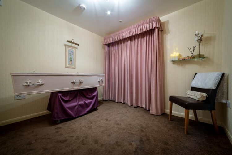 Chapel of rest viewing in Borough Green with a private room, coffin, flowers and quiet seating at the Western Road funeral home